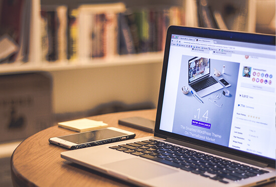 A computer on a desk, showing a website in development